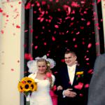 flowers thrown on bride and Groom as they exit their church wedding in poland