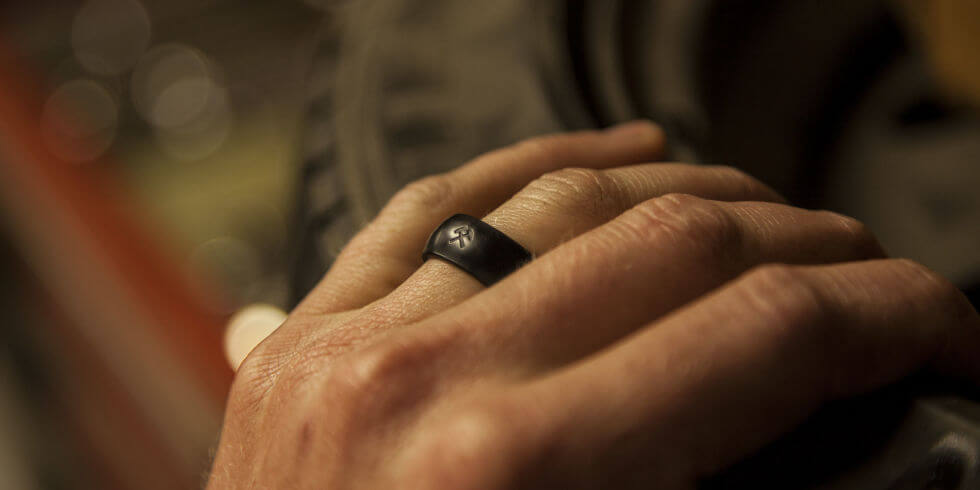 silicone wedding ring on husbands hand